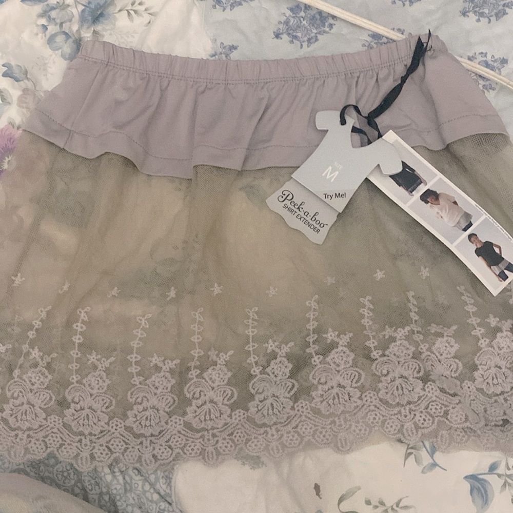 Shirt extender . NWT  grey  beautiful stitching very versatile.